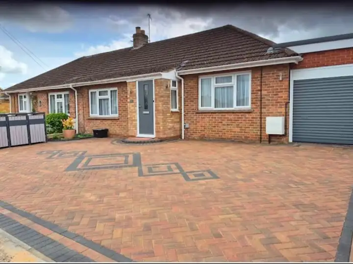 The same bungalow with a new block paved driveway and feature inlay