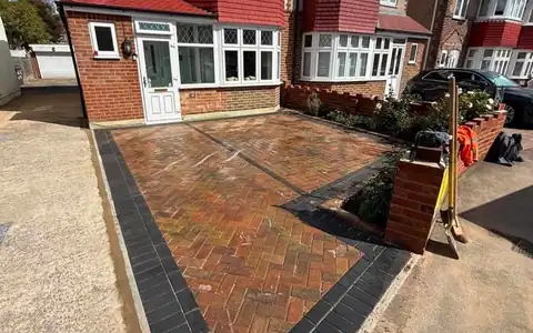 New herringbone block paving driveway with a charcoal border