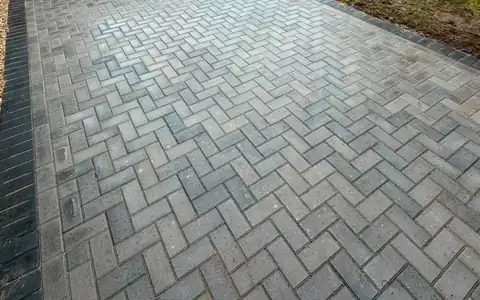 Close-up of clean herringbone block paving