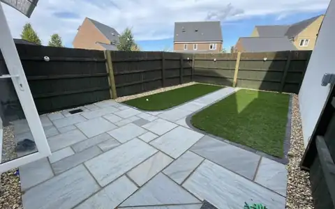New patio, lawn and fencing in a back garden