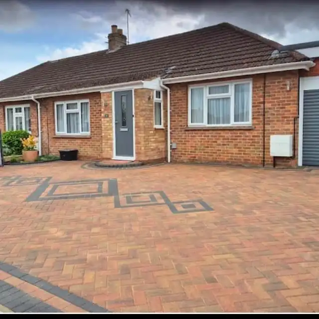 Brindle block paving with a charcoal feature inlay
