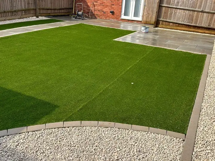 Patio and artificial lawn laid by Select Paving and Roofing