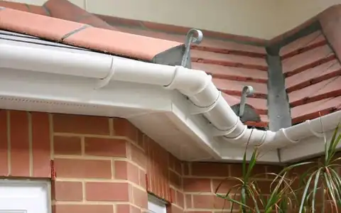 New white guttering on a brick house