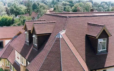 Newly tiled pitched roof with dormer windows
